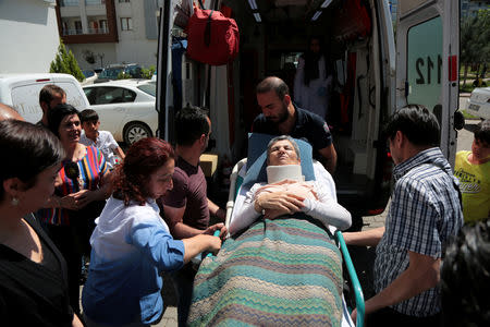 Pro-Kurdish Peoples' Democratic Party (HDP) lawmaker Leyla Guven, who ends her hunger strike after a call from jailed militant leader Abdullah Ocalan, leaves her home to go to hospital in Diyarbakir, Turkey, May 26, 2019. REUTERS/Sertac Kayar