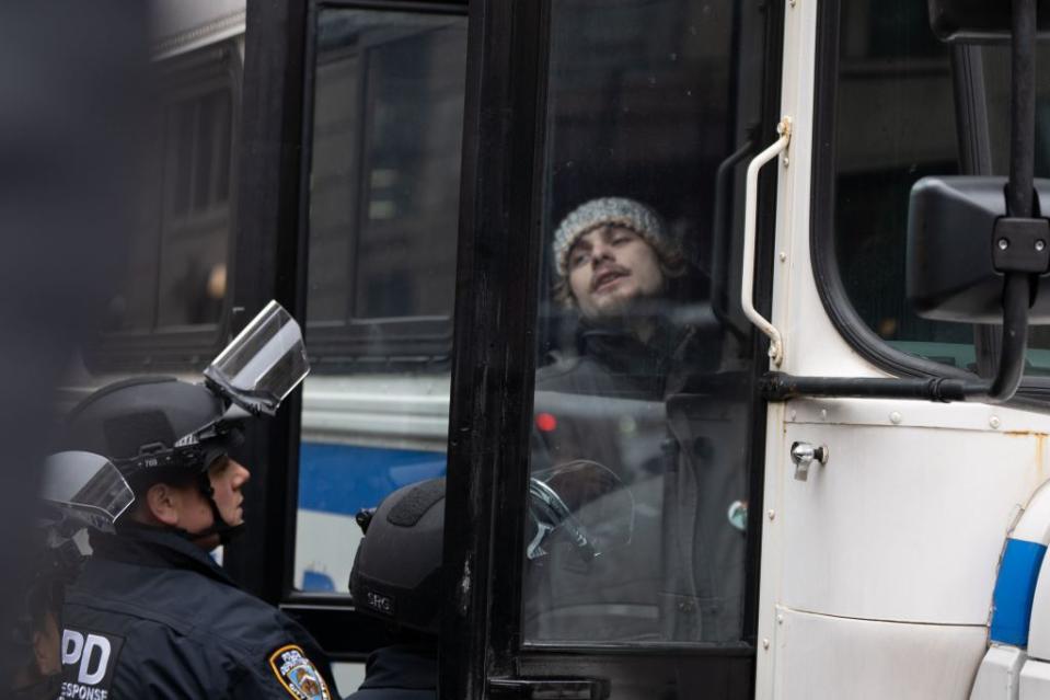 A detained protester is brought onto a bus after the NYPD swarmed Columbia. Jonah Elkowitz / NY Post