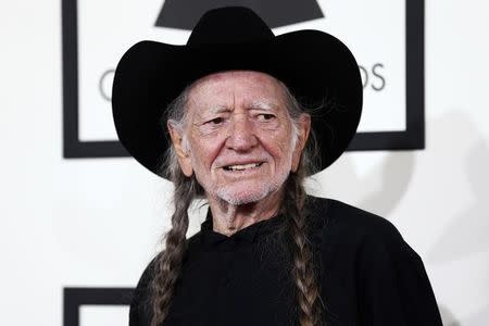 Musician Willie Nelson arrives at the 56th annual Grammy Awards in Los Angeles, California January 26, 2014. REUTERS/Danny Moloshok