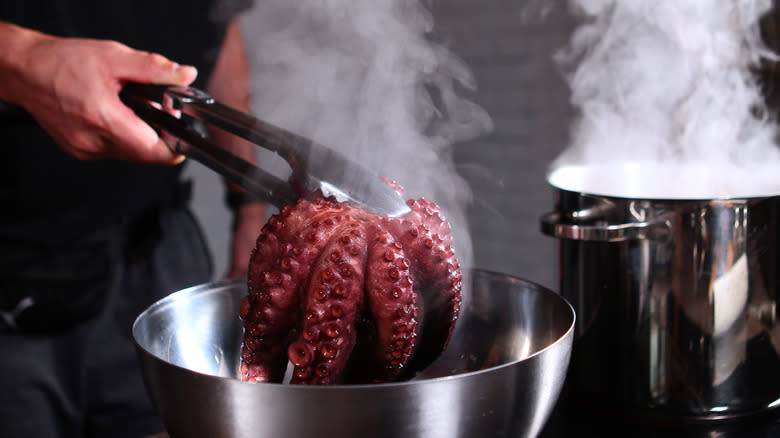 Person boiling octopus