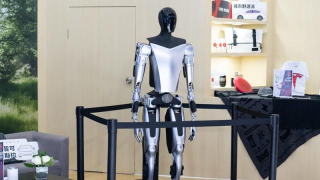 Tesla Previews Robot with Human in Spandex Suit