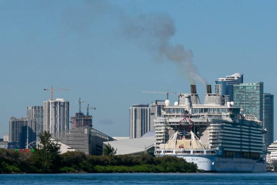 Smoke puffs out of Royal Caribbean’s Harmony of the Seas’ smokestacks as the cruise ship is docked at PortMiami on Jan. 20, 2021.