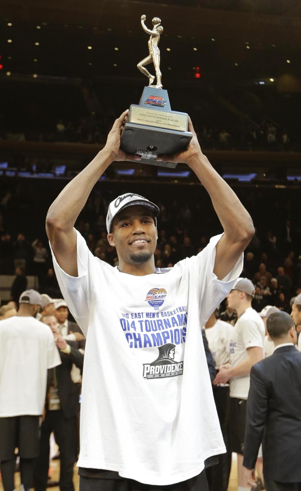 Providence's Bryce Cotton holds the Most Outstanding Player trophy after an NCAA college basketball game against Creighton in the finals of the Big East Conference tournament Saturday, March 15, 2014, at Madison Square Garden in New York. Providence won the game 65-58. (AP Photo/Frank Franklin II)