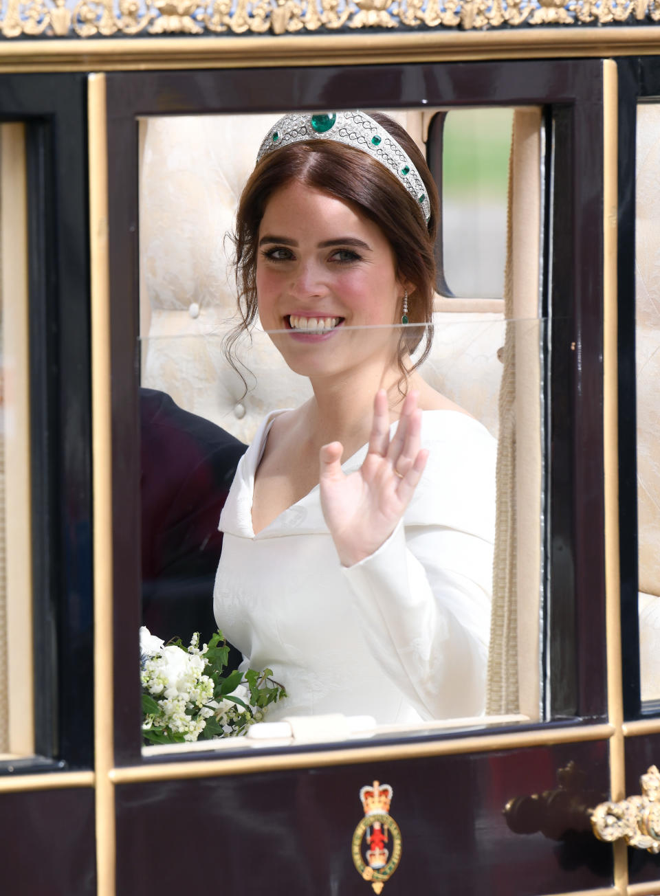 Princess Eugenie in the Scottish State Coach during the carriage procession following their wedding at St George's Chapel, Windsor Castle. Photo credit should read: Doug Peters/EMPICS