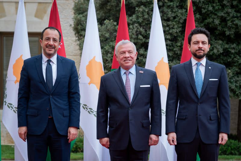 Jordan's King Abdullah II and Crown Prince Hussein pose for a picture with Cyprus President Nikos Christodoulides, in Amman