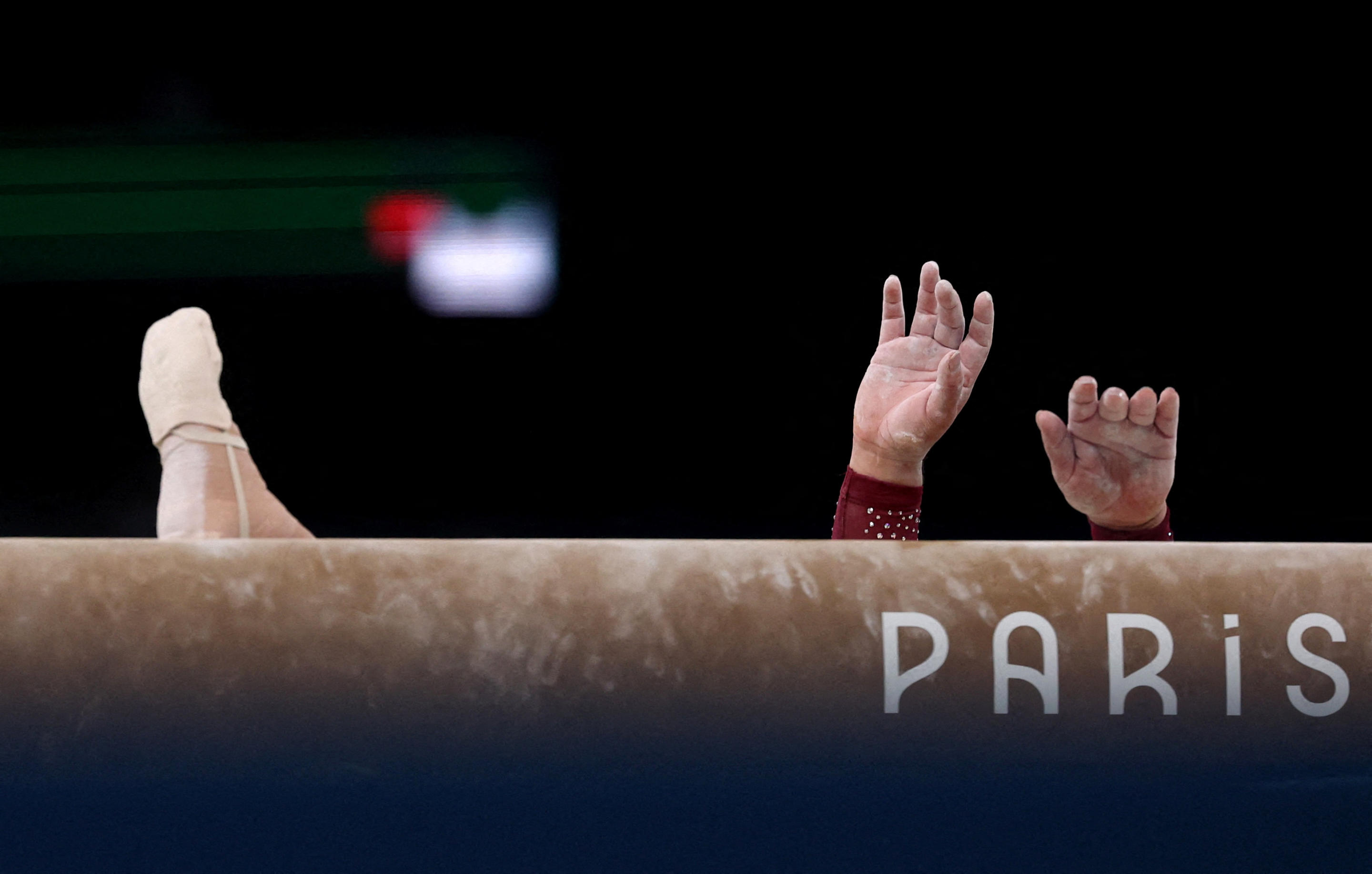 The hands and a foot of Alexa Moreno of Mexico as she falls from the balance beam during the artistic gymnastics women's qualification round.