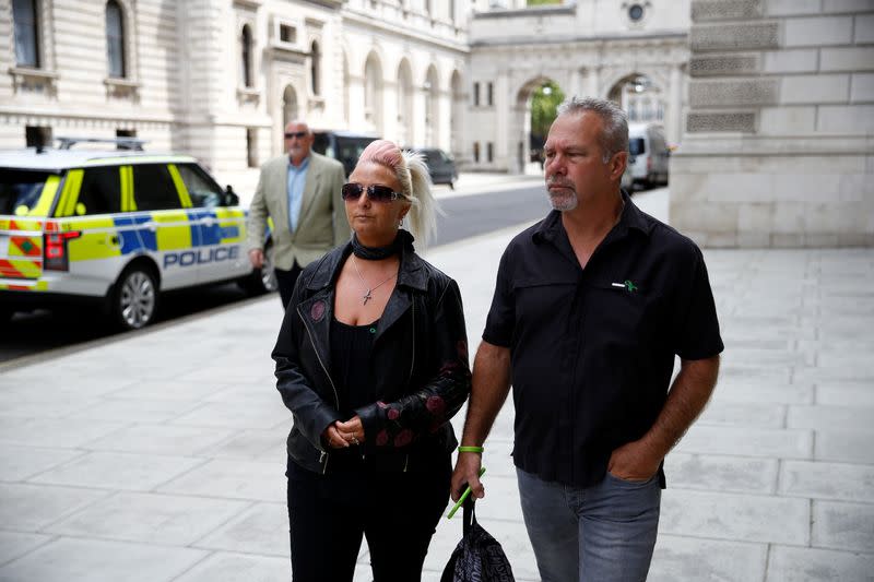 Charlotte Charles, mother of Harry Dunn, and Dunn's stepfather Bruce Charles walk outside the Foreign and Commonwealth Office in London