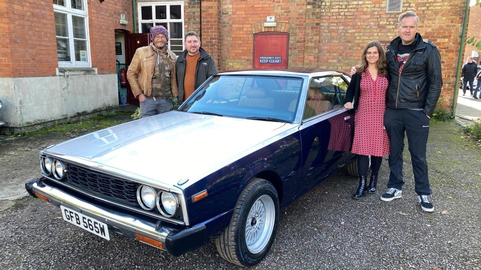 Car S.O.S hosts Fuzz Townshend and Tim Shaw stood with Adam and partner around his newly-renovated Datsun 240k Syline in Car S.O.S  season 12.