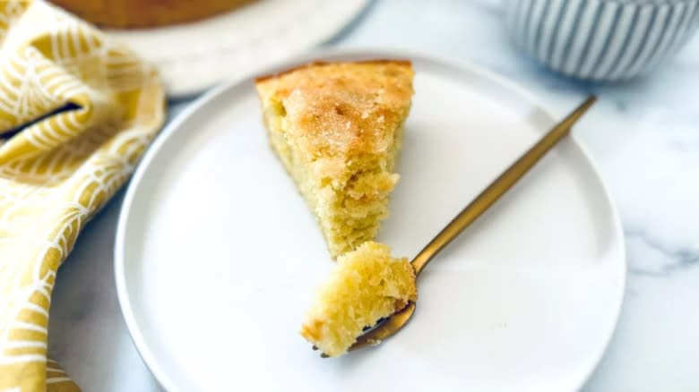 slice of lemon olive oil dump cake, fork 