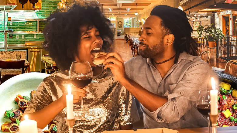 Man feeding a woman bread