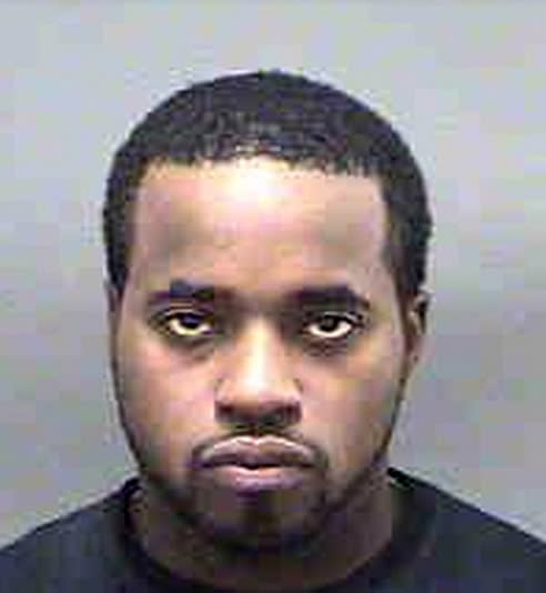 This undated photo released by the Mecklenburg (N.C.) County Sheriff's Office, shows Jeffrey Tyrone Savage, who, according to the Navy on Thursday, March 27, 2014, is the civilian who shot and killed a sailor aboard a guided-missile destroyer at the Naval Station Norfolk in Norfolk, Va., earlier this week. Savage was killed by Navy security forces aboard the USS Mahan on Monday, March 24, after he disarmed the ship's petty officer of the watch and used her gun to shoot Petty Officer 2nd Class Mark Mayo. (AP Photo/Mecklenburg (N.C.) County Sheriff's Office via The Virginian-Pilot)