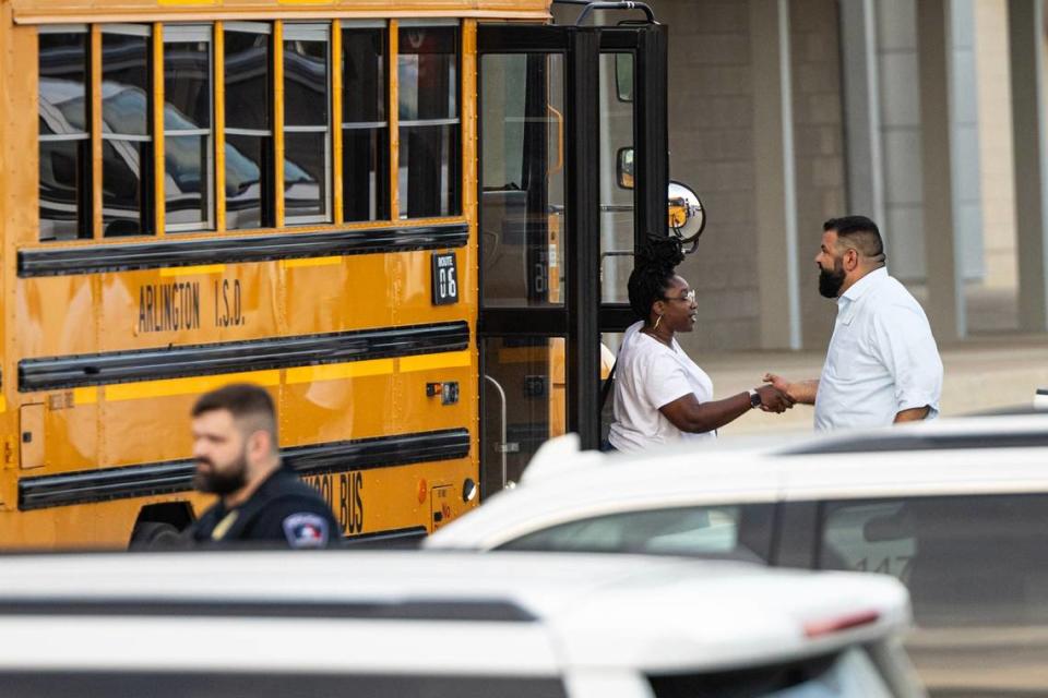 Students come out of the buses where they were shuttled from Bowie High School to be reunited with their families at Arlington ISD Athletics Center on Wednesday, April 24, 2024. Bowie High School was put on lockdown after a shooting occurred on campus where one student was killed.