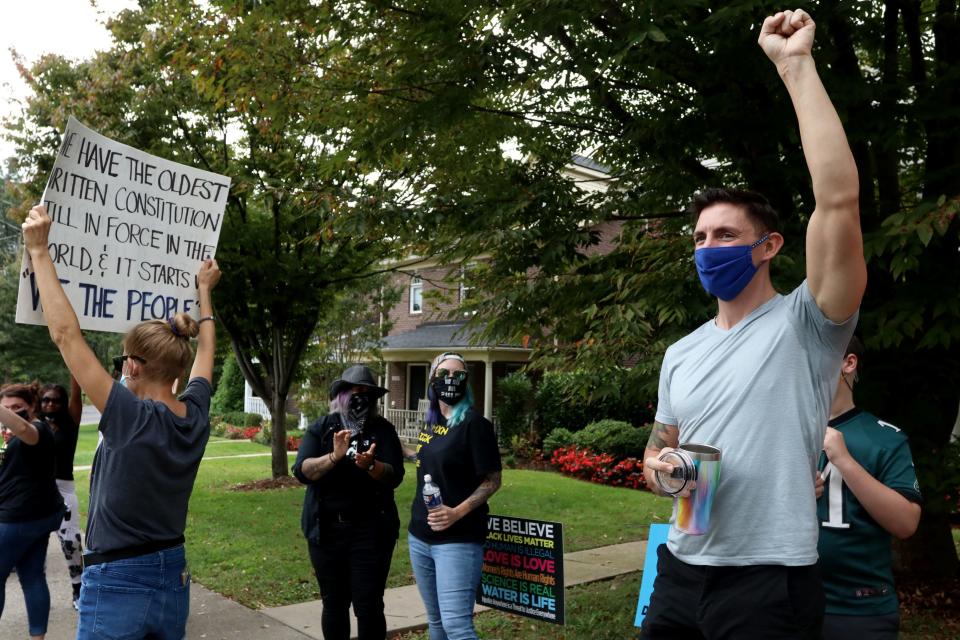 A small group of protesters gathered outside Sen. Mitch McConnell's house in Louisville, Kentucky, to call on people to "vote him out." Melissa Beckham Born, who lives near McConnell's home, said she and others will be back every Saturday leading up to the November election.