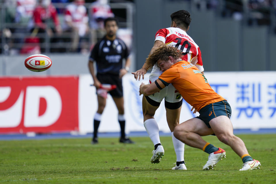 Australia's Michael Hooper tackles Japan's Rikiya Matsuda during the rugby international between the Wallabies and Japan in Oita, Japan, Saturday, Oct. 23, 2021. (AP Photo/Hiro Komae)