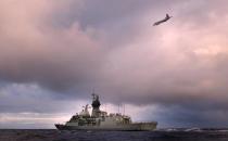 HMAS Perth and a Royal New Zealand Air Force Orion search the Southern Indian Ocean for debris from the missing Malaysia Airlines flight MH 370, April 13, 2014
