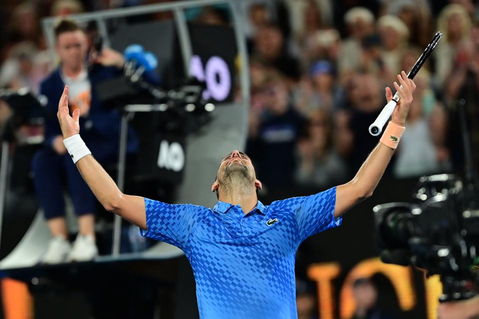 Serbia's Novak Djokovic celebrates victory in the men's singles final match against Greece's Stefanos Tsitsipas on day fourteen of the Australian Open tennis tournament in Melbourne on January 29, 2023. - -- IMAGE RESTRICTED TO EDITORIAL USE - STRICTLY NO COMMERCIAL USE -- (Photo by MANAN VATSYAYANA / AFP) / -- IMAGE RESTRICTED TO EDITORIAL USE - STRICTLY NO COMMERCIAL USE -- (Photo by MANAN VATSYAYANA/AFP via Getty Images)