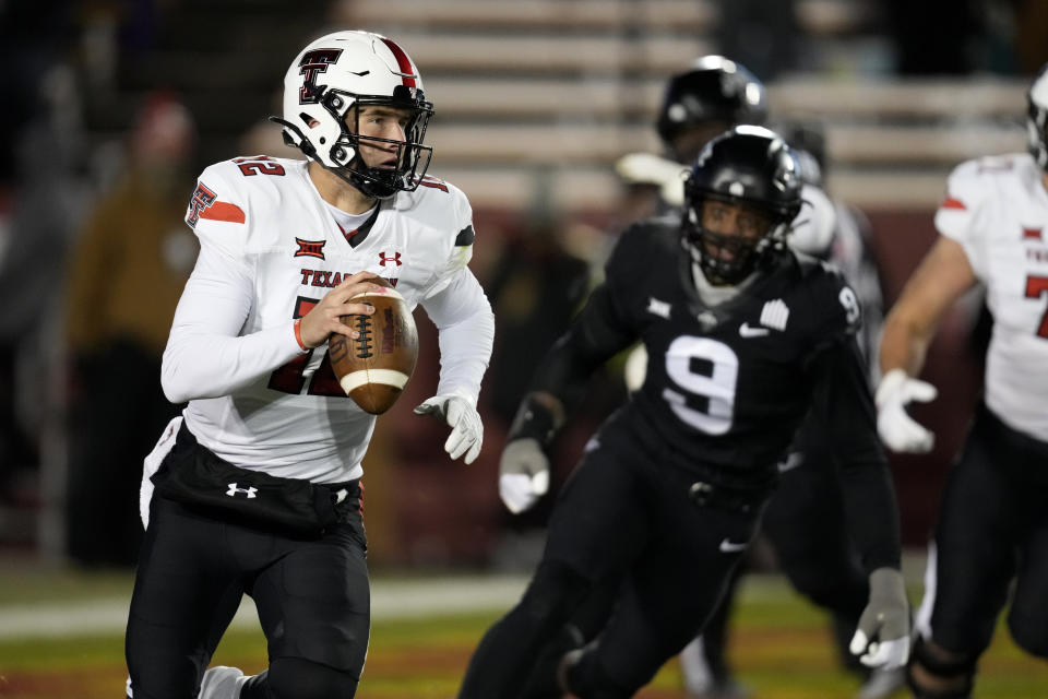 Texas Tech quarterback Tyler Shough (12) runs from Iowa State defensive end Will McDonald IV (9) during the first half of an NCAA college football game, Saturday, Nov. 19, 2022, in Ames, Iowa. (AP Photo/Charlie Neibergall)