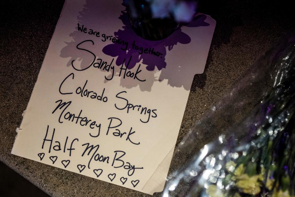 A note is seen at a makeshift memorial at Mac Dutra Park in response to a fatal mass shooting the day before, in Half Moon Bay, Calif., Tuesday, Jan. 24, 2023. The suspect, 66-year-old Chunli Zhao, was arrested in what investigators believe to be workplace violence.