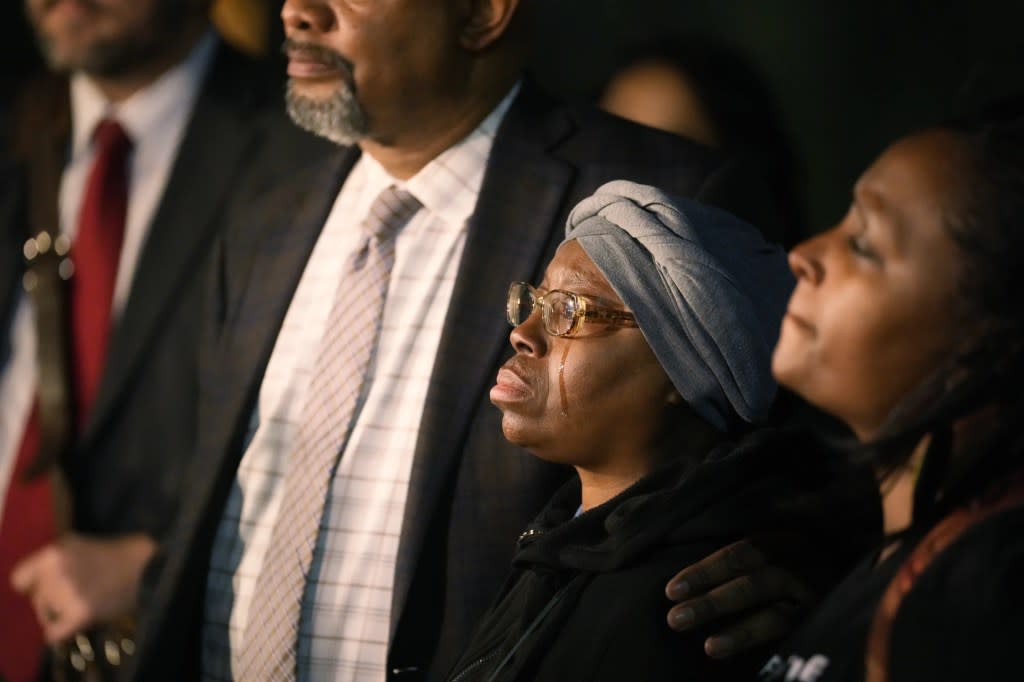 A tear runs down the cheek of Sheneen McClain as she is consoled by Omar Montgomery, president of the Aurora NAACP, outside the Adams County Colo., Justice Center, after a verdict was rendered in the killing of her son Elijah McClain, Friday, Dec. 22, 2023, in Brighton, Colo. (AP Photo/David Zalubowski)
