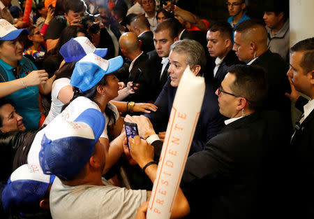 Right wing presidential candidate Ivan Duque greets supporters after polls closed in the first round of the presidential election in Bogota, Colombia May 27, 2018. REUTERS/Nacho Doce