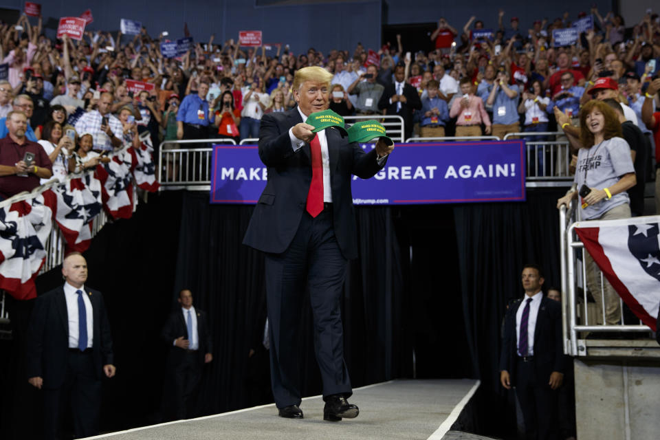 President Donald Trump arrives to speak at a campaign rally at the Ford Center, Thursday, Aug. 30, 2018, in Evansville, Ind. (AP Photo/Evan Vucci)