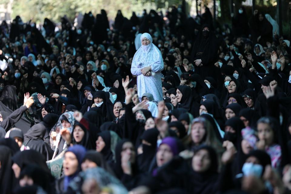 Iranians shout pro-government slogans after performing Friday prayer at Tehran University (Anadolu Agency via Getty Images)