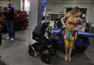 <p>Ringling Bros. high wire performer Anna Lebedeva stands next to her 3-month-old son, Amir, in his stroller while waiting to go on for the show’s finale, Friday, May 5, 2017, in Providence, R.I. Lebedeva and her husband, fellow performer Mustafa Danguir, dream of starting their own show, or maybe opening a circus school in Morocco to teach future generations. They’re optimistic something good will come along. (Photo: Julie Jacobson/AP) </p>