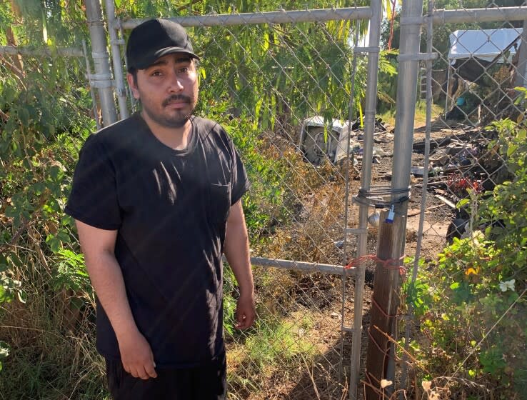 Juan Zetina outside of his home that burned in East Orosi.