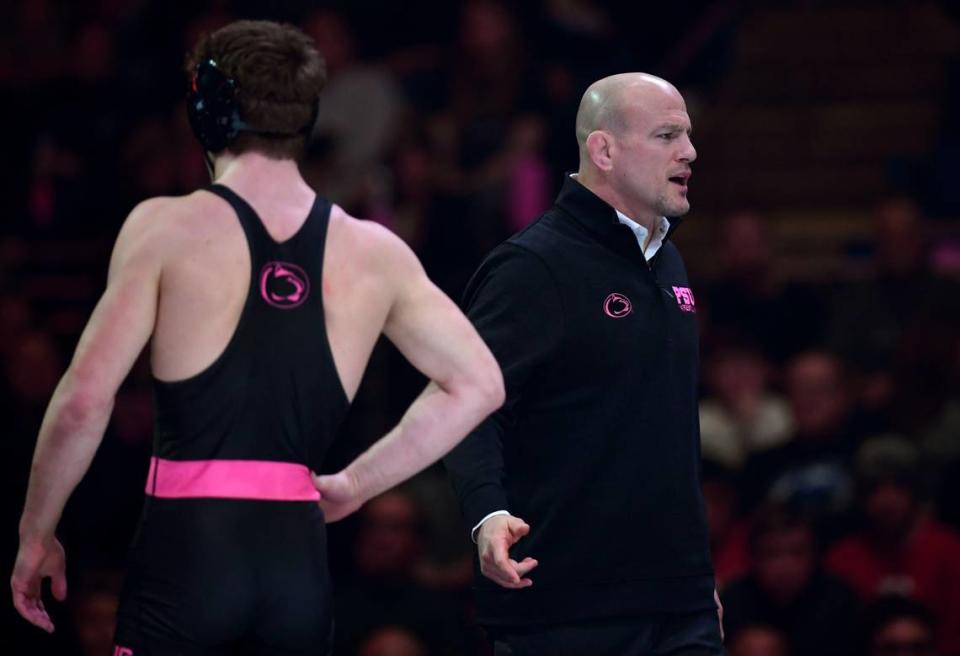 Penn State wrestling coach Cael Sanderson looks to refs for the call during the match on Monday, Feb. 12, 2024 at the Bryce Jordan Center.