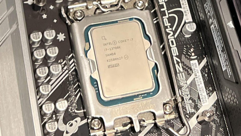 An Intel Core i7-13700K inserted into a motherboard