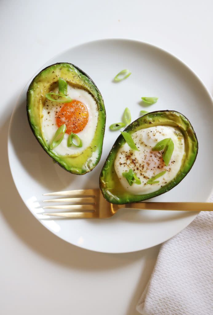 <p>Say hello to the weight-loss breakfast of champions. Eggs <a href="https://www.womansday.com/health-fitness/g22640015/best-protein-powders-women/" rel="nofollow noopener" target="_blank" data-ylk="slk:provide protein;elm:context_link;itc:0;sec:content-canvas" class="link ">provide protein</a> and essential nutrients, sure, but the real star here is the avocado. Not only is it filled with vitamins, but it also has omega-3 fatty acids that <a href="https://watermark.silverchair.com/milmed-d-14-00154.pdf?token=AQECAHi208BE49Ooan9kkhW_Ercy7Dm3ZL_9Cf3qfKAc485ysgAAAccwggHDBgkqhkiG9w0BBwagggG0MIIBsAIBADCCAakGCSqGSIb3DQEHATAeBglghkgBZQMEAS4wEQQMejza1X9mO_ZT4UWPAgEQgIIBerW3d9Fg8JlO8hBe1Xpk1Ett4W81BrWQW5qSE0fp9875GeWaalVy1KcV69hiR-nz49Co9xbM52HImP2Zxc9h5KHUcYAz9XclFvTvB0Wda4Jy_vkWgYEuuuQQodpd_QjUsj6Na6rSl1e5bCEQAuL3IxyuYdRDg8LdYEwZseUPFd0BhfS6UZaX848H1XCyHi7vAsKsBYu-OW4n_E1ESmQ0FujlBtaD_BJDZ7Mit4SHHmtmpIaYTEQEeCJ53WVADRVR6ZuaCqY1yksEyzYSo27yDpJKtsQnadzq12oMRkgXyMELSX_POtsH3iq9-i8iB7dSlUATO_JwoKy_rs3QYdUfHI9mAtzVkAaUDh8L8n9SaqTtGTzRABuKY5ZkWIjQWmZXWcQ4T_MAh3F8hn_yr6keFmso7MLg5V-hQidKRQaqDiGeDM_vXDrASGk17TivV0__4PjRGt31X3WbL69MfSgMuUleyiXcCjCrEk8fnQl57-CnlnmUSr5rLxJYyQ" rel="nofollow noopener" target="_blank" data-ylk="slk:have been shown;elm:context_link;itc:0;sec:content-canvas" class="link ">have been shown</a> to help suppress appetite, since mono- and poly-unsaturated fats (AKA the good fats) promote satiety. They also help<a href="https://www.womansday.com/health-fitness/nutrition/g1087/how-to-speed-up-your-metabolism/" rel="nofollow noopener" target="_blank" data-ylk="slk:boost your metabolism;elm:context_link;itc:0;sec:content-canvas" class="link "> boost your metabolism</a>, and the oleic acid found in the green fruit is a type of omega-9 fatty acid — meaning it <a href="https://www.ncbi.nlm.nih.gov/pubmed/25347552" rel="nofollow noopener" target="_blank" data-ylk="slk:may reduce hunger;elm:context_link;itc:0;sec:content-canvas" class="link ">may reduce hunger</a> and decrease the number of calories you take in at your next meal. Another incentive to dig in: the <a href="https://www.ahajournals.org/doi/full/10.1161/JAHA.114.001355" rel="nofollow noopener" target="_blank" data-ylk="slk:American Heart Association;elm:context_link;itc:0;sec:content-canvas" class="link ">American Heart Association</a> says eating an avocado a day may keep the bad cholesterol away. </p><p><strong>Get the recipe at <a href="https://nutritiouslife.com/recipes/avocado-boat-egg-bake/" rel="nofollow noopener" target="_blank" data-ylk="slk:Nutritious Life;elm:context_link;itc:0;sec:content-canvas" class="link ">Nutritious Life</a>.</strong> <br></p>