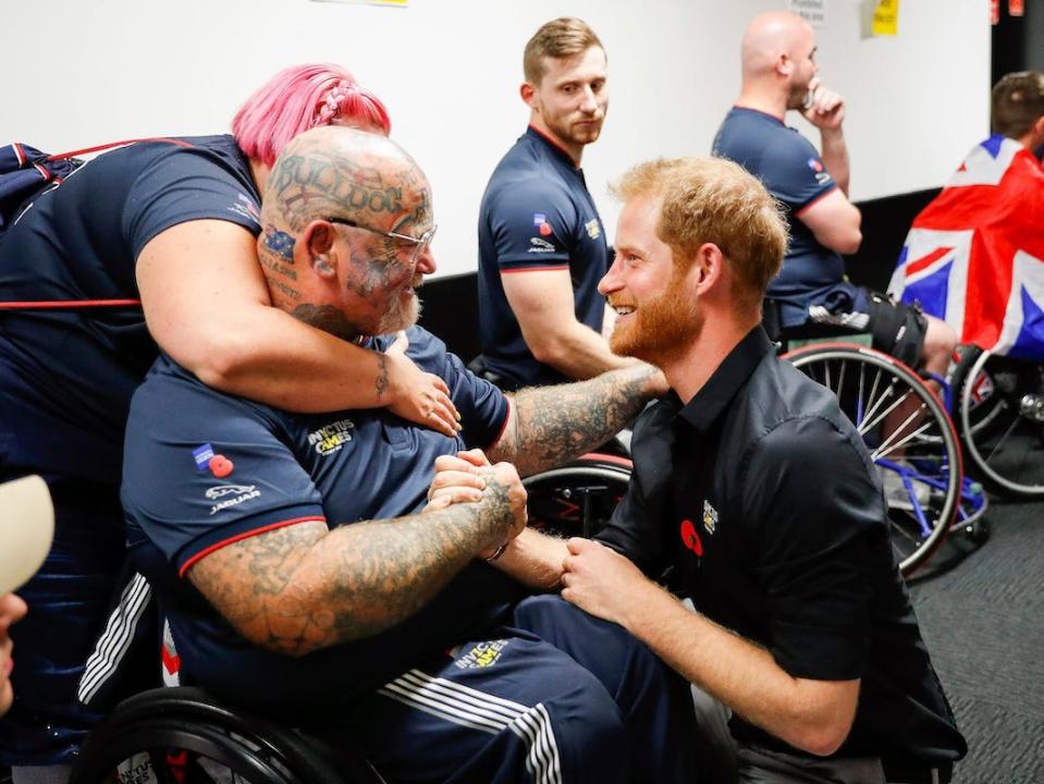 Prince Harry congratulates Paul Guest of the US wheelchair basketball team after winning the gold medal in the finals during day eight of the Invictus Games Sydney, Australia, Saturday, Oct. 27, 2018.