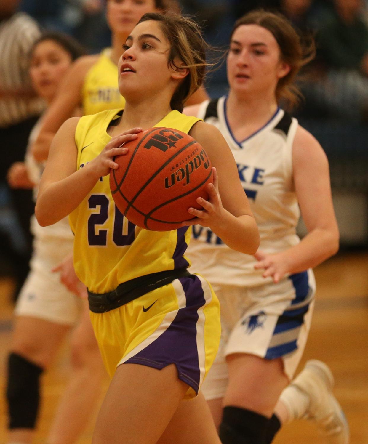 Ozona High School's Jaylynn Tijerina drives to the basket as Lake View's Mikaila Wagner closes in during a game at Ben Norton gym on Tuesday, Dec. 7, 2021.