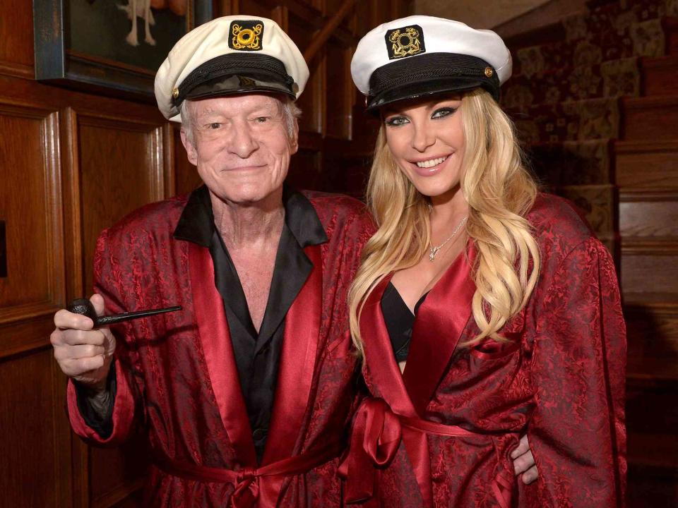 <p>Charley Gallay/Getty</p> Hugh Hefner and his wife Crystal Hefner attend Playboy Mansion