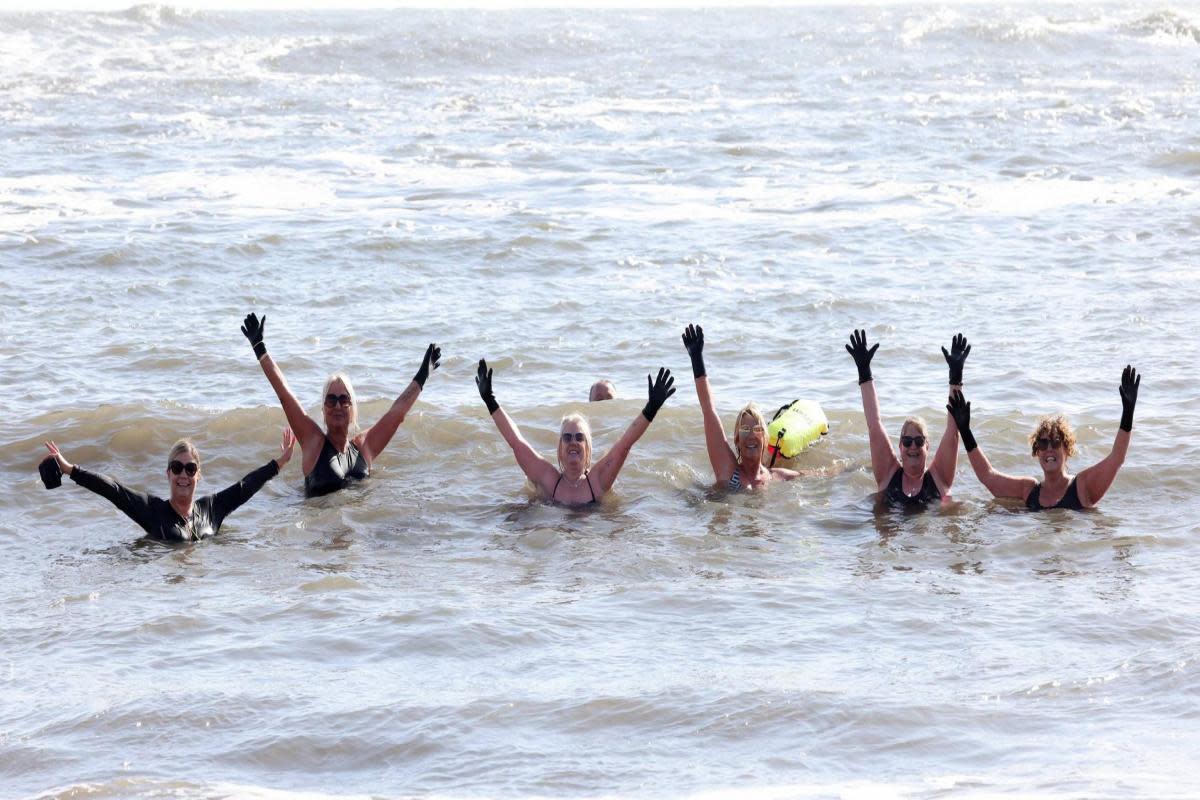 Dippers enjoy a freezing cold dip in the North Sea this morning (SAT) on a sunny day at Cullercoats Bay in North Tyneside, as beachgoers enjoy the sunshine this weekend. <i>(Image: North News)</i>