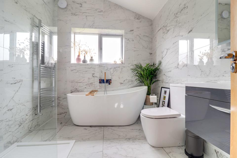 This ensuite bathroom is styled the same as the family bathroom. This one has a floating bath and large walk-in shower. (Photo: Prime Location/EweMove)