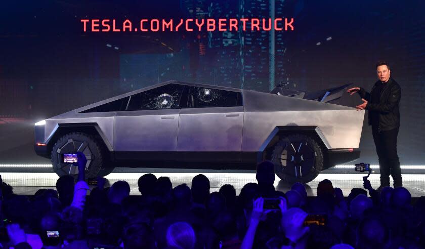 Tesla co-founder and CEO Elon Musk gestures while wrapping up his presentation of the newly unveiled all-electric battery-powered Tesla Cybertruck at Tesla Design Center in Hawthorne, California on November 21, 2019. (Photo by Frederic J. BROWN / AFP) (Photo by FREDERIC J. BROWN/AFP via Getty Images)