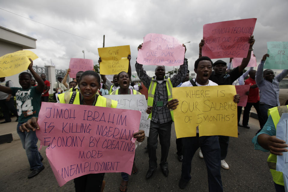 Former Air Nigeria staff protest after they were fired in Lagos, Nigeria, Friday, Sept. 7, 2012. More than 60 workers from Air Nigeria protested Friday at Lagos’ Murtala Muhammed International Airport’s domestic terminal, demanding four-months-worth of unpaid salaries from the company. The airline’s owner, business tycoon Jimoh Ibrahim, fired nearly all of the company’s 800 employees for “disloyalty” earlier this month. (AP Photo/Sunday Alamba)