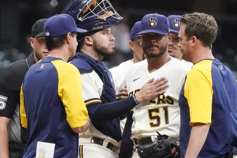 Milwaukee Brewers' Freddy Peralta is taken out of the game during the third inning of game 2 of a doubleheader baseball game against the San Francisco Giants Thursday, Sept. 8, 2022, in Milwaukee. (AP Photo/Morry Gash)