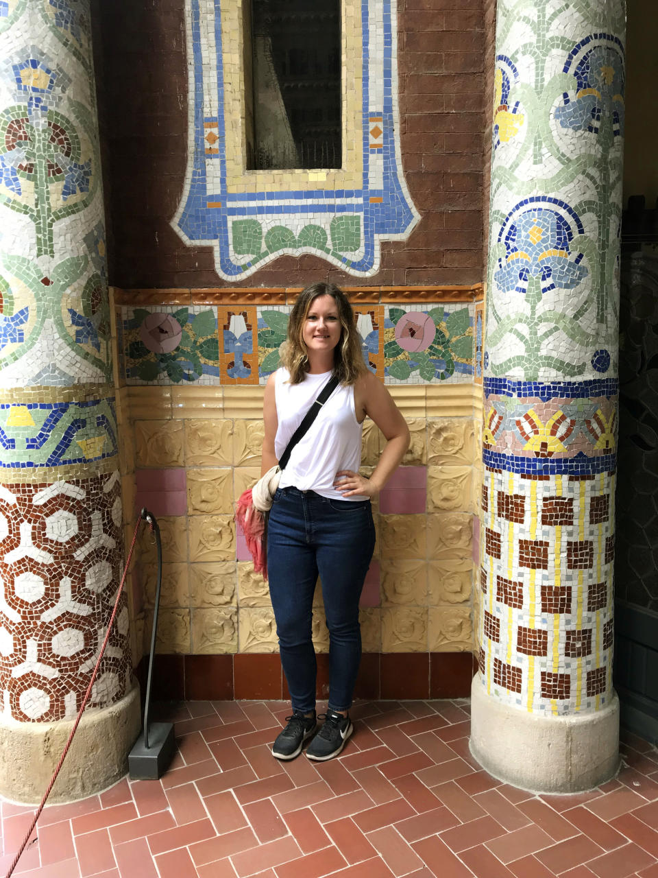 This Oct. 14, 2019 photo shows Associated Press writer Courtney Bonnell posing in front of the mosaic-encrusted terrace of architect Lluís Domènech I Montaner’s Palau de la Música Catalana in Barcelona, Spain. f you’re taking a solo trip for the first time, a European city like Barcelona is a good place to start. The city is dynamic, the streets and cafes are always packed, it’s safe to walk around at night and people mostly speak English. (Courtney Bonnell via AP)
