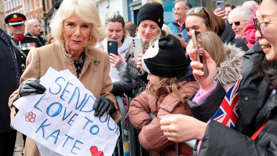 PHOTO: Britain's Queen Camilla receives a message of support for Princess Catherine, during her visit to the Farmers' Market, March 27, 2024, in Shrewsbury, England. (Chris Jackson/AP)