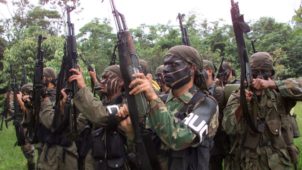 In this file photo from May 2000, members of United Self-Defense Forces (AUC) brandish their weapons during a training session in a rural area of Puerto Asis, Putumayo province southern of Colombia. - Reuters/File