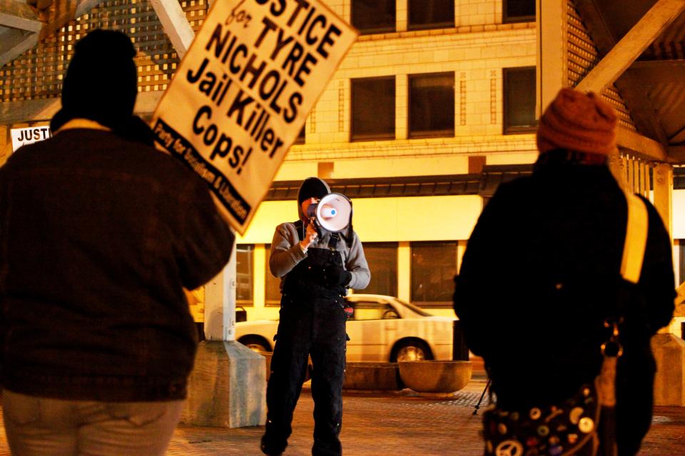 Seth Goodwin, a member of the Party for Socialism and Liberation, speaks during a protest Sunday evening in Park Central Square.