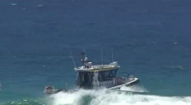 A rescue boat was seen scouring the water on Sunday. Photo: 7 News