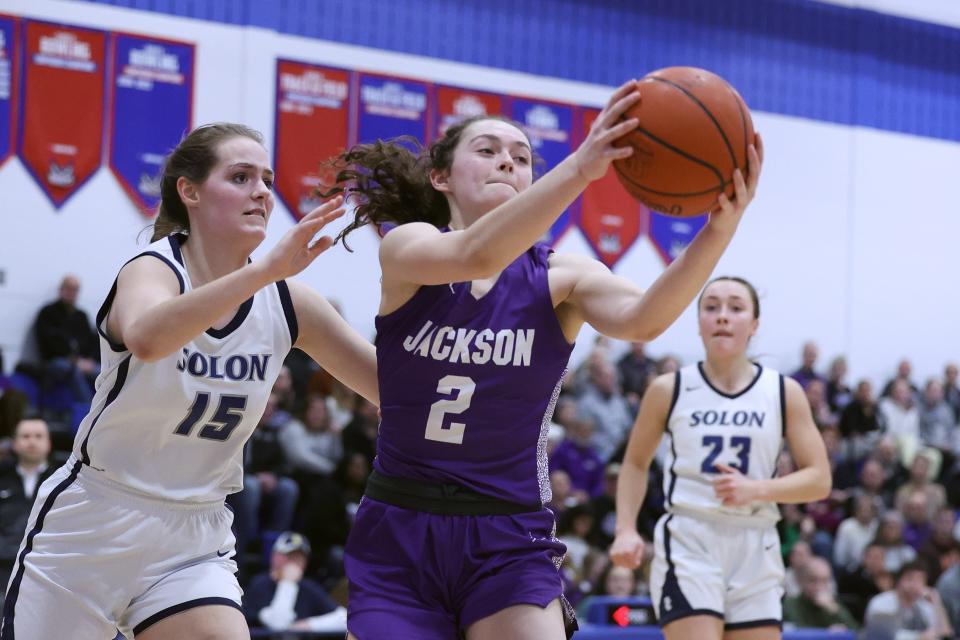 Jackson junior Ashley Lahmers grabs a loose ball during the Division I district final against Solon, Friday, Feb. 24, 2023, at Ravenna High School.