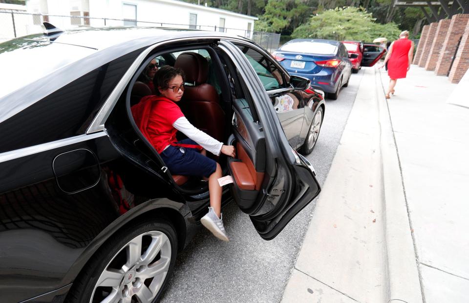 Gisele Dillard is picked up by her mom Kristen and sister London after school at Largo-Tibet Elementary.