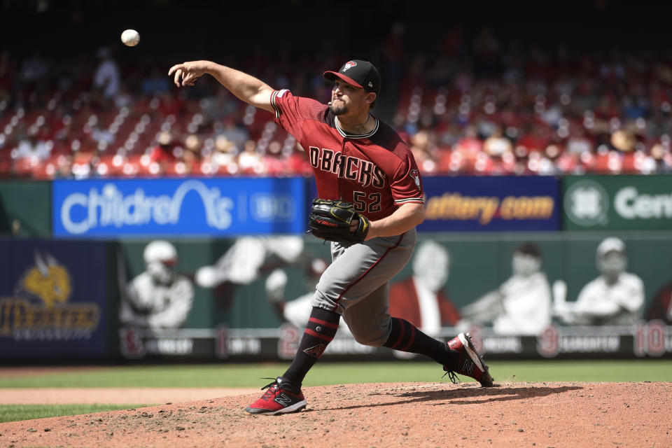 Jul 14, 2019; St. Louis, MO, USA; Arizona Diamondbacks starting pitcher Zack Godley (52) pitches against the St. Louis Cardinals during the eighth inning at Busch Stadium. Mandatory Credit: Joe Puetz-USA TODAY Sports