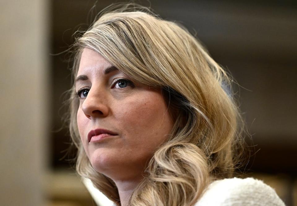 Minister of Foreign Affairs Melanie Joly  listens to questions from reporters in the Foyer of the House of Commons on Parliament Hill after Question Period, in Ottawa on Thursday, Feb. 29, 2024.