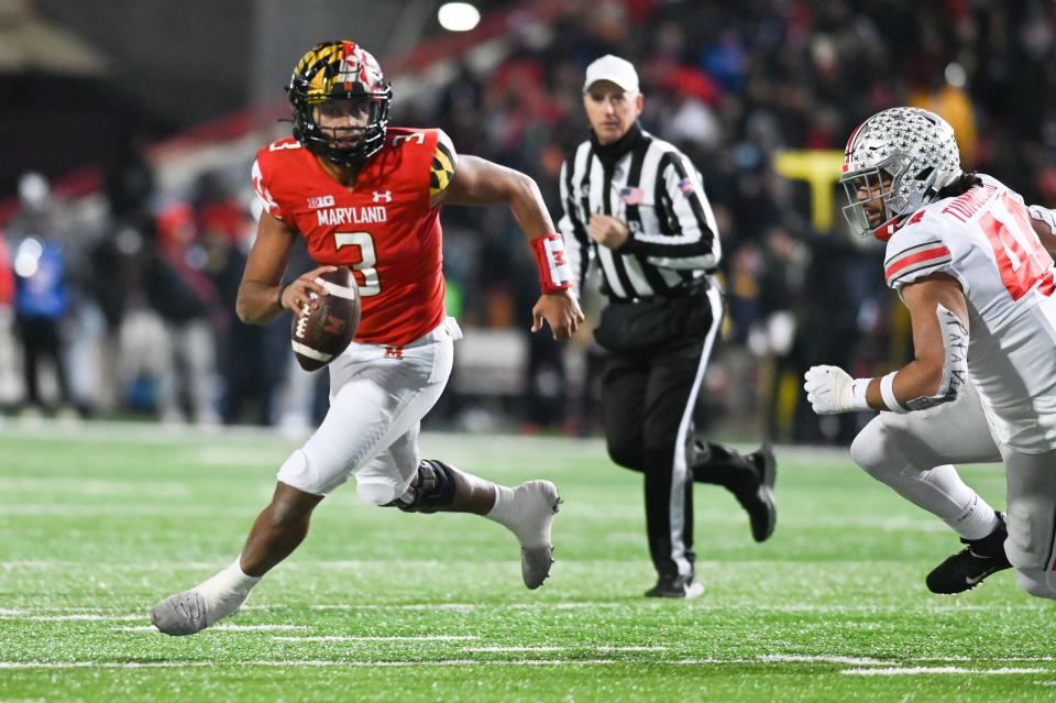 Maryland Terrapins quarterback Taulia Tagovailoa (3) run by Ohio State Buckeyes defensive end J.T. Tuimoloau (44) during the second half at SECU Stadium.