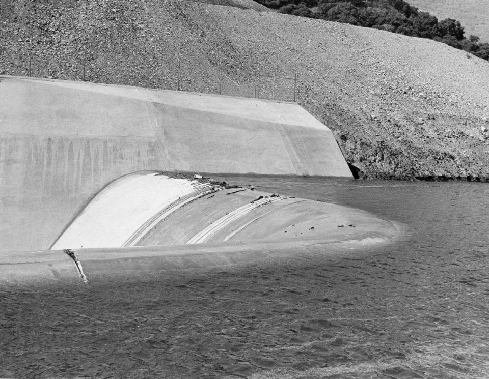 The wake of a touring outboard splashes water over the spillway at Lopez Lake.It would spill for the first time on April 19, 1969. Photo first published 4-18-1969.